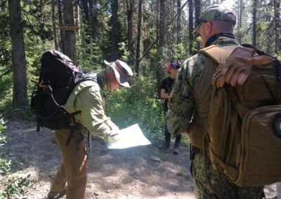 Former Teton County Sheriff’s Detective Dave Hodges points at a map during a hunt for Mike Bullinger’s body with the U.S. Marshals Service.