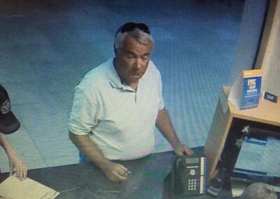 A surveillance capture of Mike Bullinger at a car dealership in Ogden, Utah.