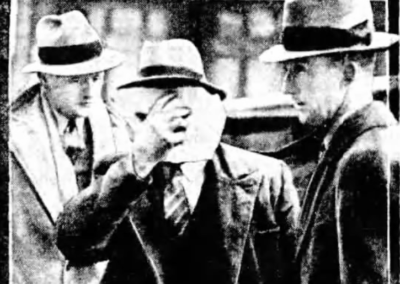 man being escorted into court