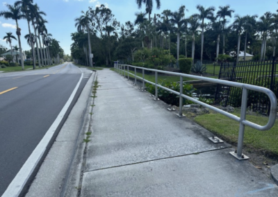 Photo of sidewalk with palm trees